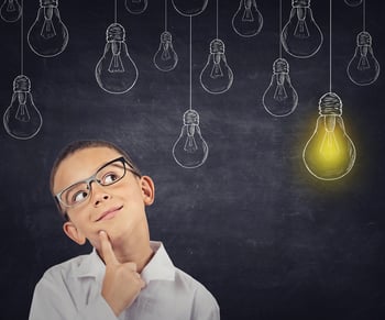 Big idea. Smart boy with solution lightbulb above head